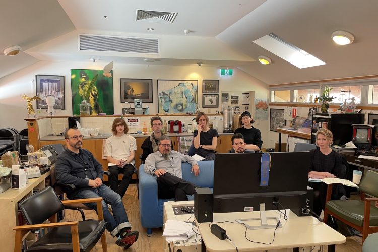 Image of SymbioticA staff and residents watching a talk by Paul Vanouse